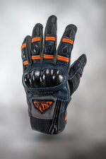Fly Ignitor Pro Men’s Heated Motorcycle Gloves in Black with Orange Liner — upside-down back view showing integrated hard knuckle armor and reflective accents