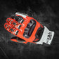 Arctiva Meridian men's Waterproof Snow Gloves A red and black motorcycle glove with carbon fiber knuckle protection on a textured dark background. The glove appears durable and high-tech.