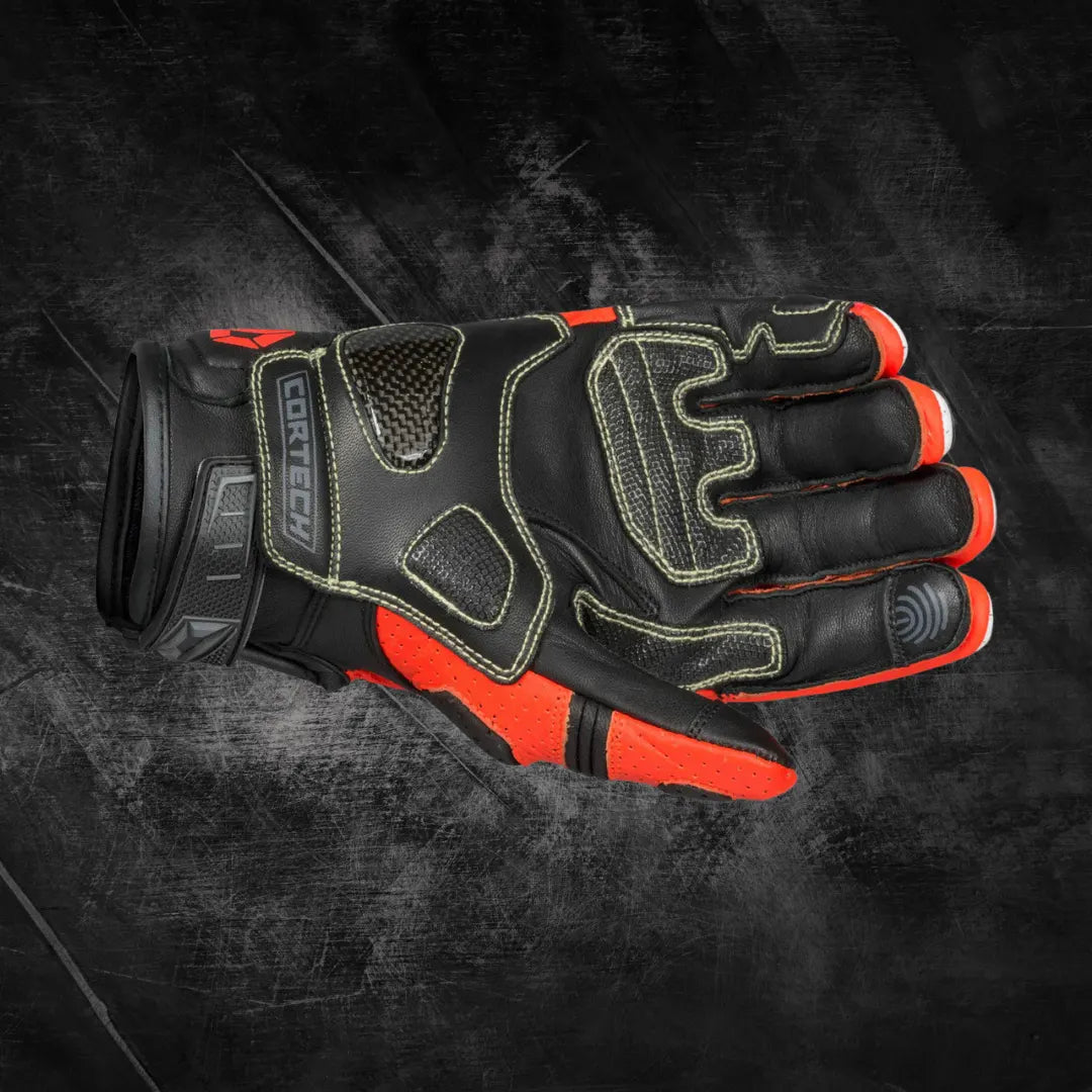 Arctiva Meridian Men’s Waterproof Snow Gloves in Orange and Black — Front view highlighting padded protective lines, durable knuckle reinforcement, and insulated snow riding design