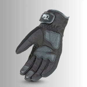 Close-up of Joe Rocket Ballistic Ultra Women's motorcycle glove showing molded knuckle armor, touchscreen-compatible fingertip, and slip-resistant padded palm.