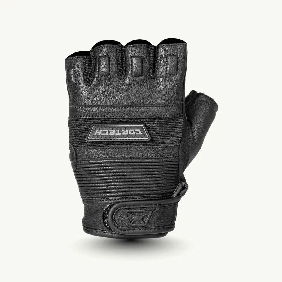 Cortech flip-off fingerless leather motorcycle gloves worn on hand, offering a stylish design and comfort for riders seeking freedom and protection.