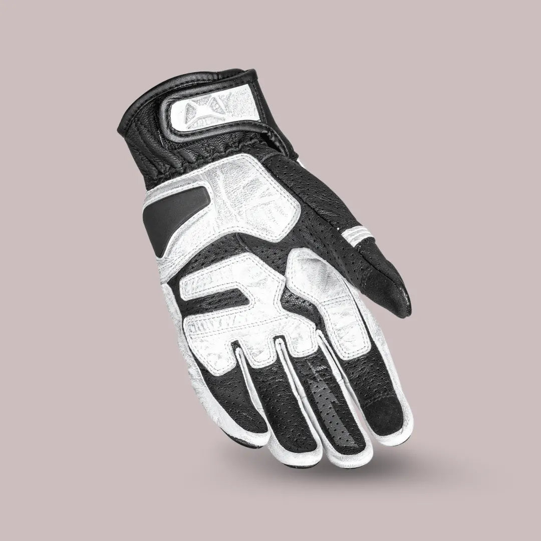 Angled view of Cortech Bully 2.0 short cuff leather glove in white and black, highlighting pre-curved fingers for ergonomic comfort.