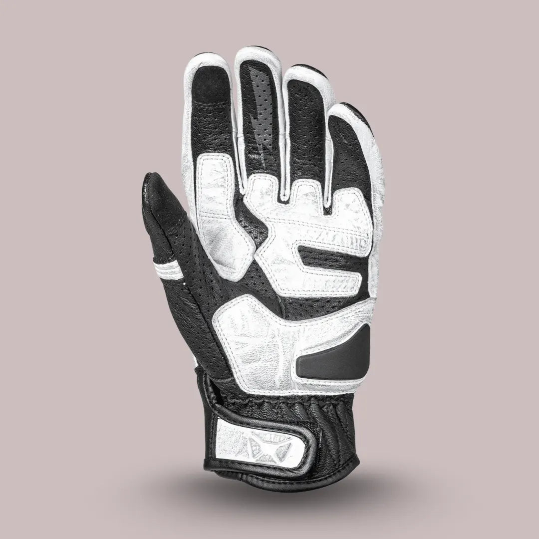 Back view of white and black Cortech Bully 2.0 motorcycle glove, showing knuckle protector and accordion stretch panels.