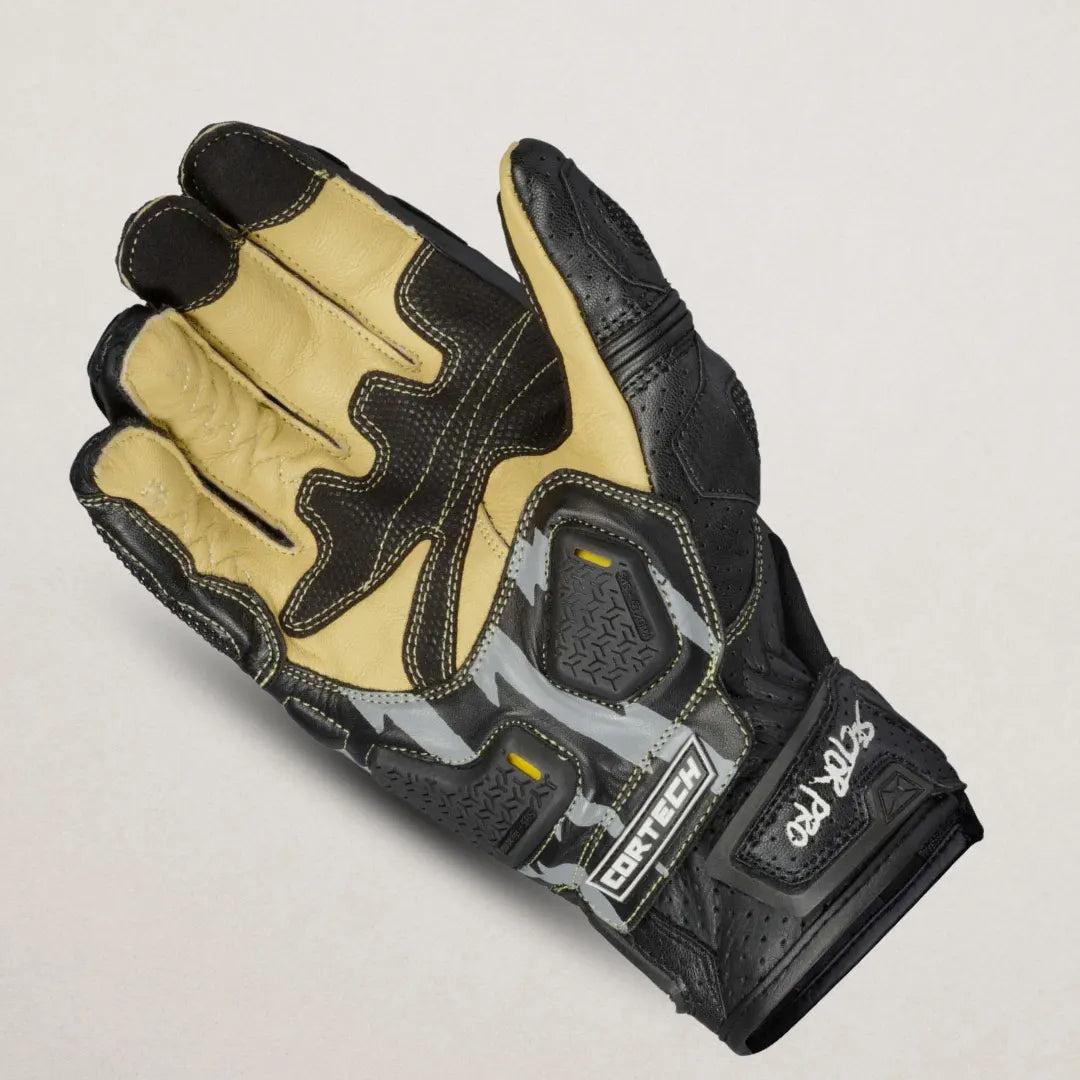 Front view of Cortech Sector Pro ST glove in black and white leather showing pre-curved fingers, reversed-seam construction, and KNOX® SPS palm slider.