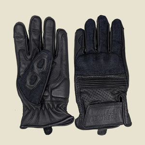 Black denim leather motorcycle gloves with mobile phone touchscreen compatibility for enhanced grip and protection.
