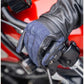 Leather motorcycle glove on hand, gripping a motorcycle handlebar with touchscreen functionality for mobile use with blue and black color