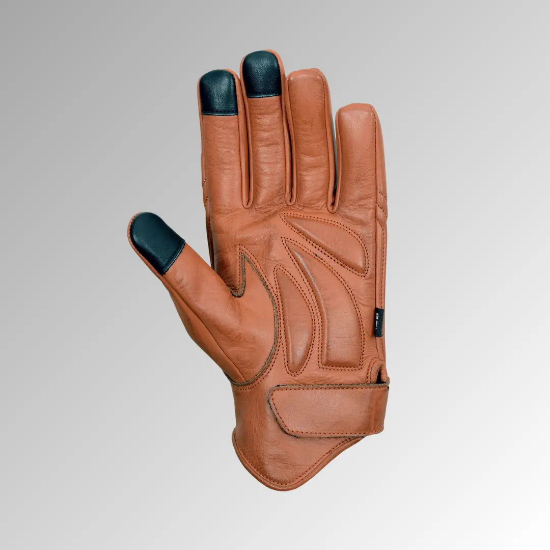 Close-up of single Vance Leather brown motorcycle glove highlighting touchscreen compatible index finger and thumb.