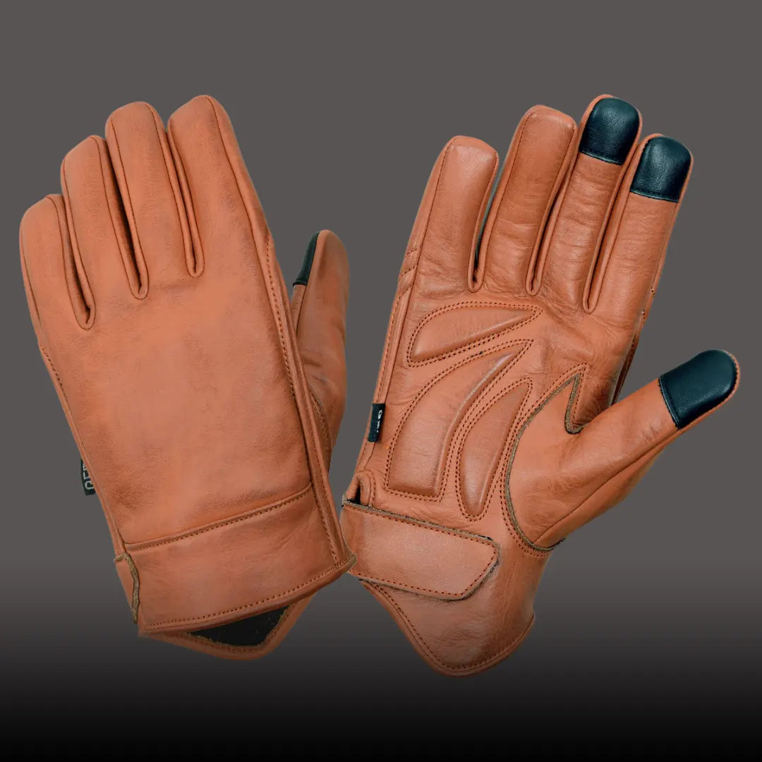 Pair of MG Leather brown motorcycle riding gloves laid together, showing premium leather texture and comfortable fit.