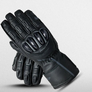 RST Men's S1 waterproof Leather Black motorcycle gloves with reinforced knuckles and fingers, featuring sleek design and stitching, displayed against a light gray background.