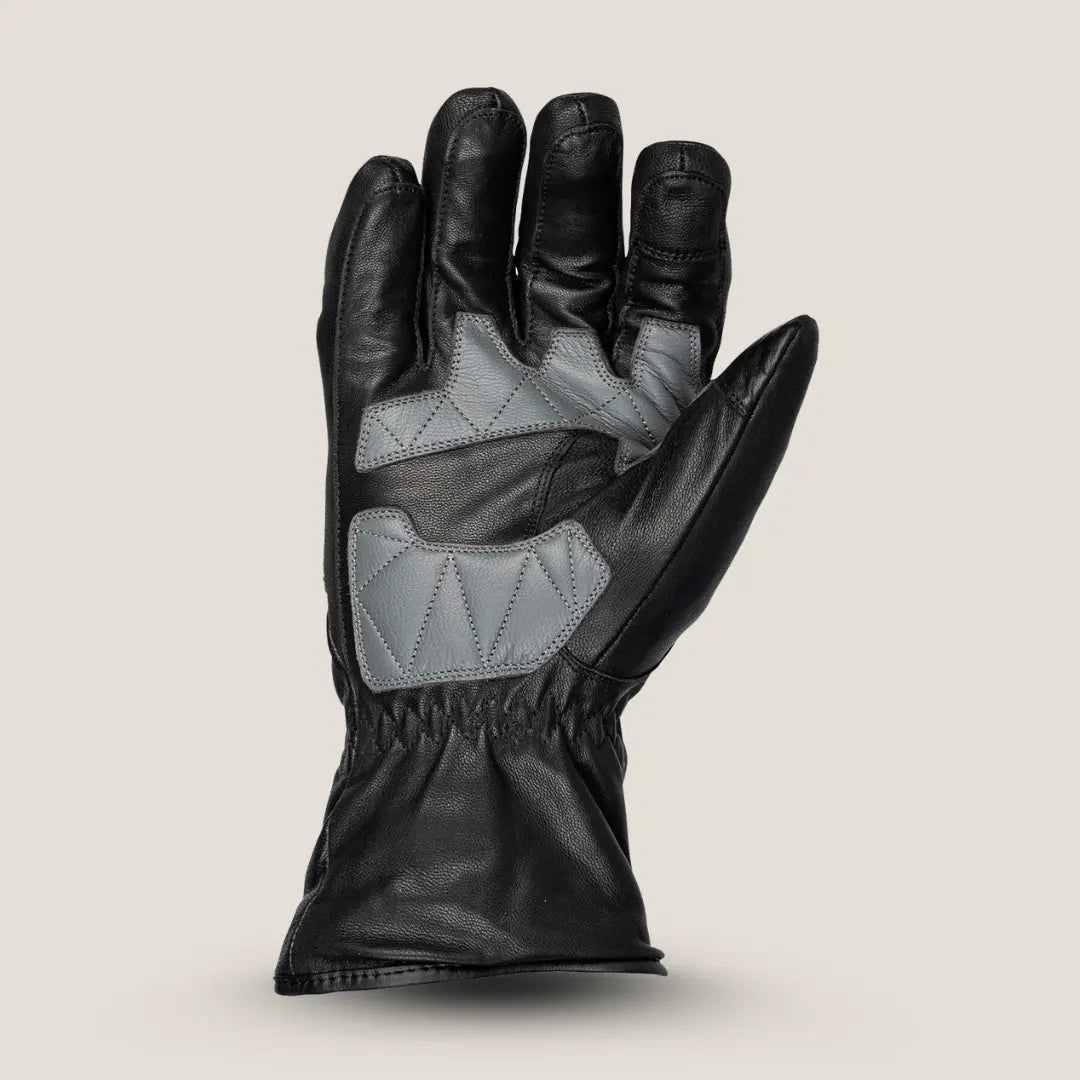 Tour Master women’s leather glove detail showing touchscreen-compatible index finger and reflective print on cuff